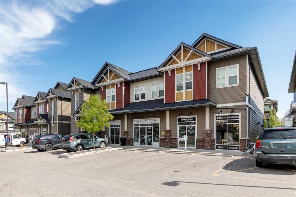 140 Sundown Road, Cochrane, AB - Outdoor With Facade