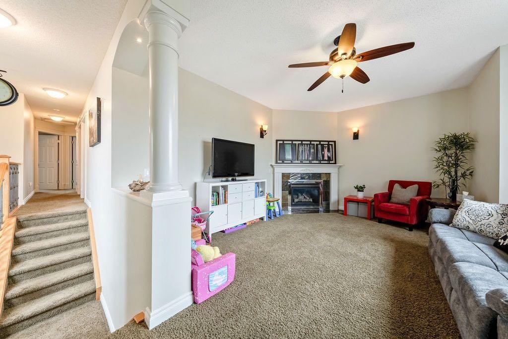 4 Cimarron Trail, Okotoks, AB - Indoor With Fireplace