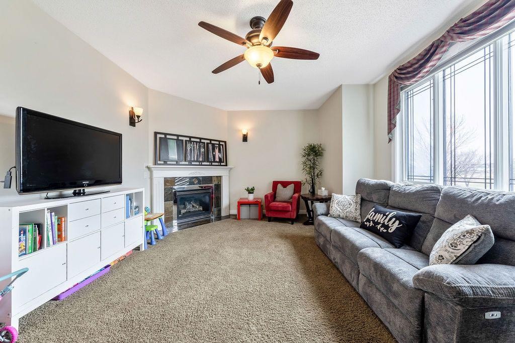 4 Cimarron Trail, Okotoks, AB - Indoor Photo Showing Living Room With Fireplace