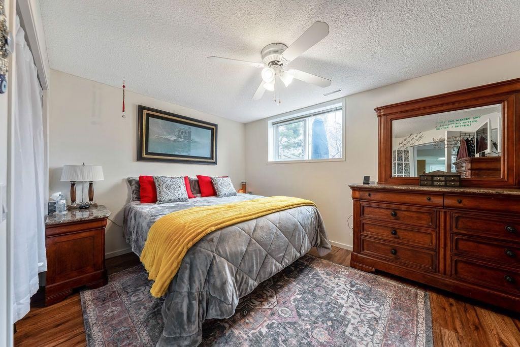 4 Cimarron Trail, Okotoks, AB - Indoor Photo Showing Bedroom
