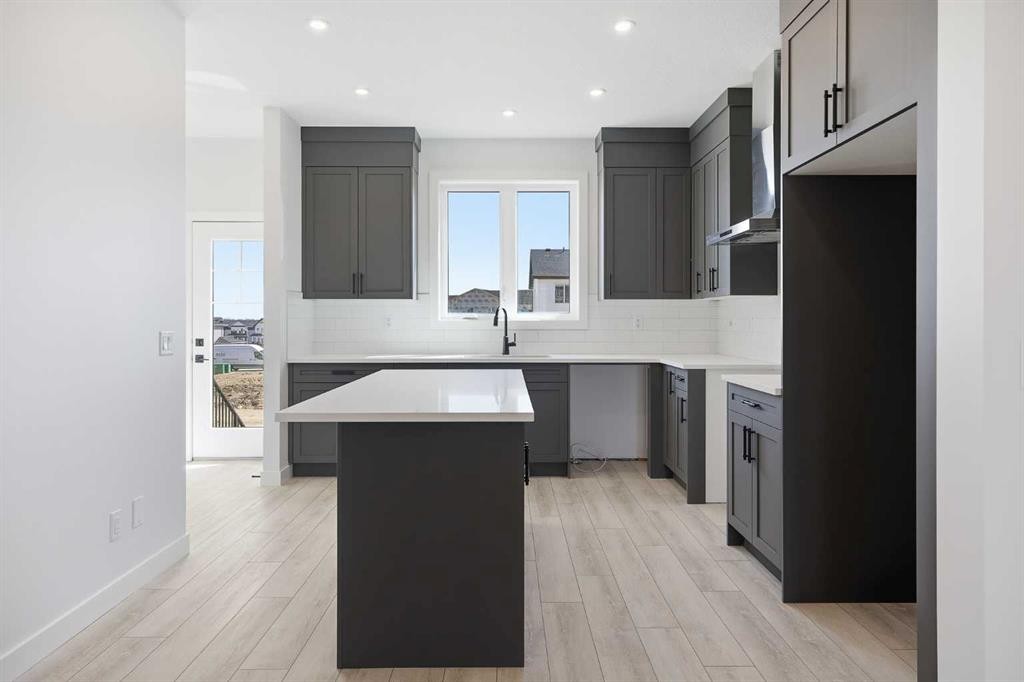 217 Bridgeport Gate, Chestermere, AB - Indoor Photo Showing Kitchen With Upgraded Kitchen