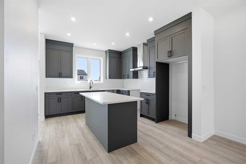 217 Bridgeport Gate, Chestermere, AB - Indoor Photo Showing Kitchen With Upgraded Kitchen