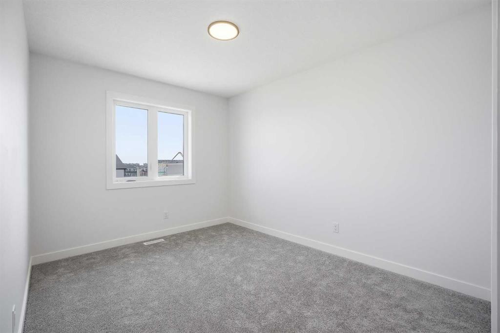 217 Bridgeport Gate, Chestermere, AB - Indoor Photo Showing Other Room