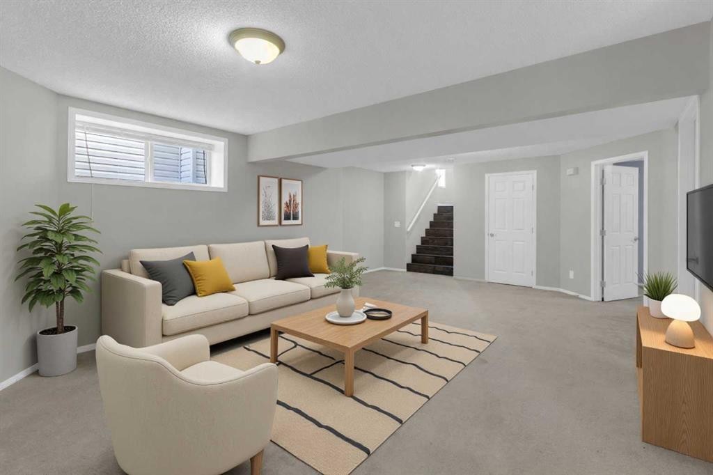 24 Evansbrooke Point Nw, Calgary, AB - Indoor Photo Showing Living Room