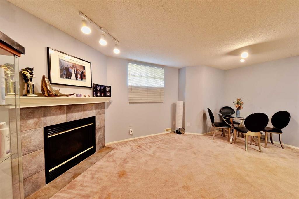 105 Coral Springs Close Ne, Calgary, AB - Indoor With Fireplace