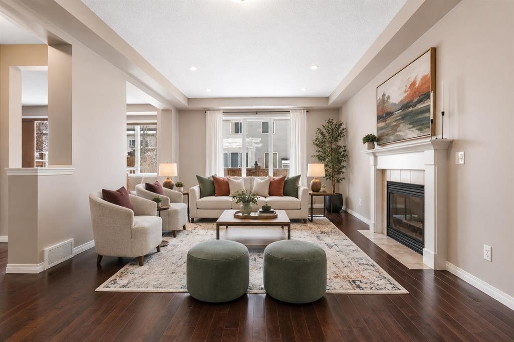 149 Windridge Road Sw, Airdrie, AB - Indoor Photo Showing Living Room With Fireplace