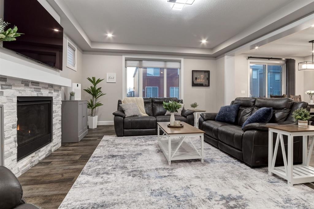 166 Osborne Common Sw, Airdrie, AB - Indoor Photo Showing Living Room With Fireplace