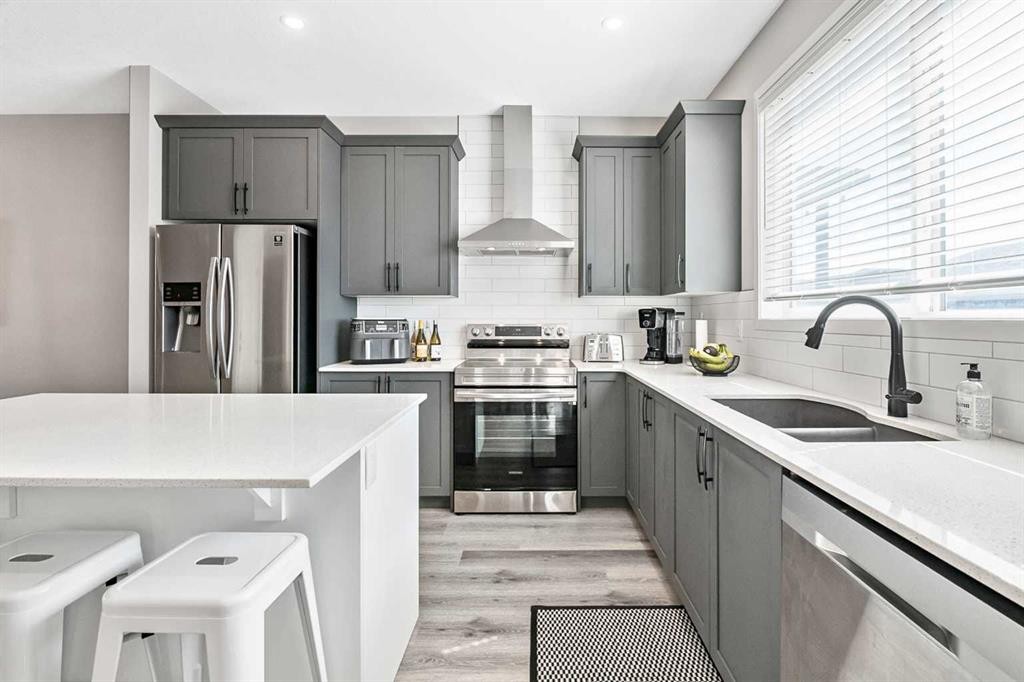 68 Wolf Gate, Okotoks, AB - Indoor Photo Showing Kitchen With Double Sink With Upgraded Kitchen