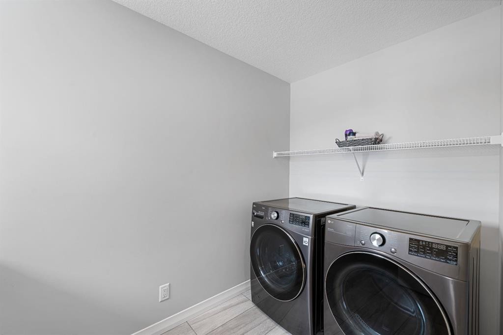 308 Lucas Way Nw, Calgary, AB - Indoor Photo Showing Laundry Room