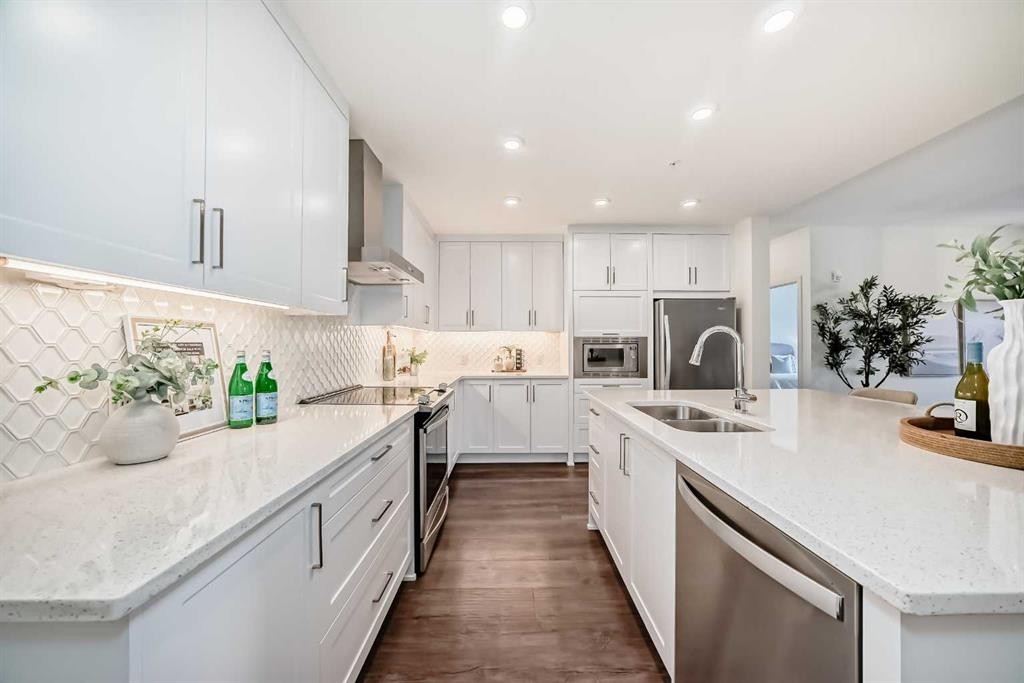 307-12 Mahogany Path Se, Calgary, AB - Indoor Photo Showing Kitchen With Stainless Steel Kitchen With Double Sink With Upgraded Kitchen