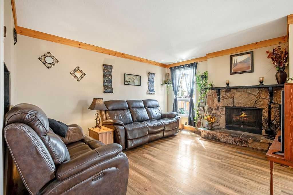 197 Abergale Close Ne, Calgary, AB - Indoor Photo Showing Living Room With Fireplace