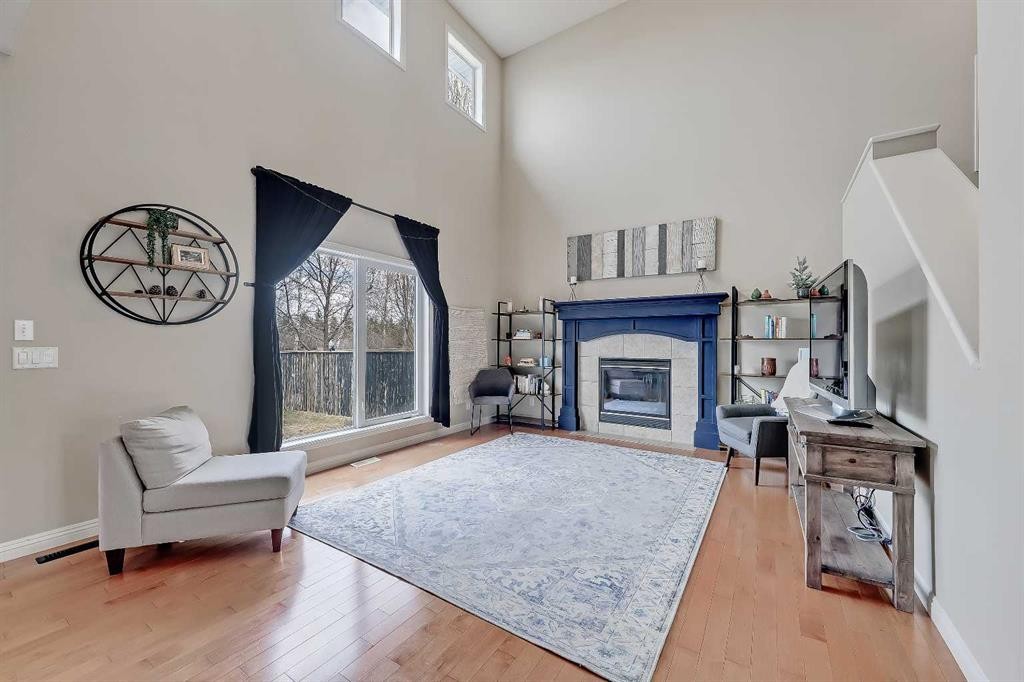 196 Hawkmere Way, Chestermere, AB - Indoor Photo Showing Living Room With Fireplace