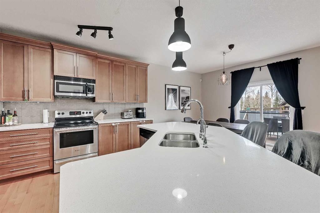 196 Hawkmere Way, Chestermere, AB - Indoor Photo Showing Kitchen With Double Sink