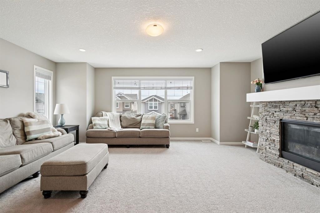 80 Brightoncrest Point Se, Calgary, AB - Indoor Photo Showing Living Room With Fireplace