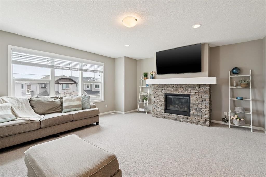 80 Brightoncrest Point Se, Calgary, AB - Indoor Photo Showing Living Room With Fireplace