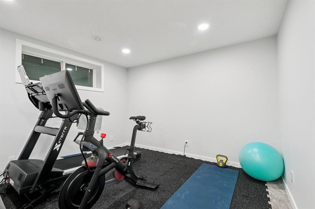 80 Brightoncrest Point Se, Calgary, AB - Indoor Photo Showing Gym Room