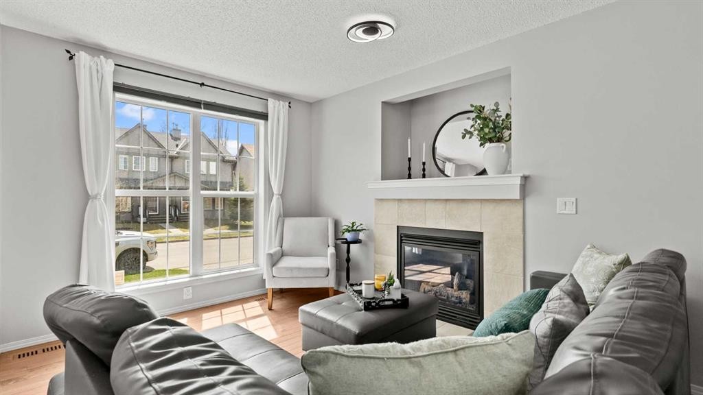 95 Elgin Meadows View Se, Calgary, AB - Indoor Photo Showing Living Room With Fireplace