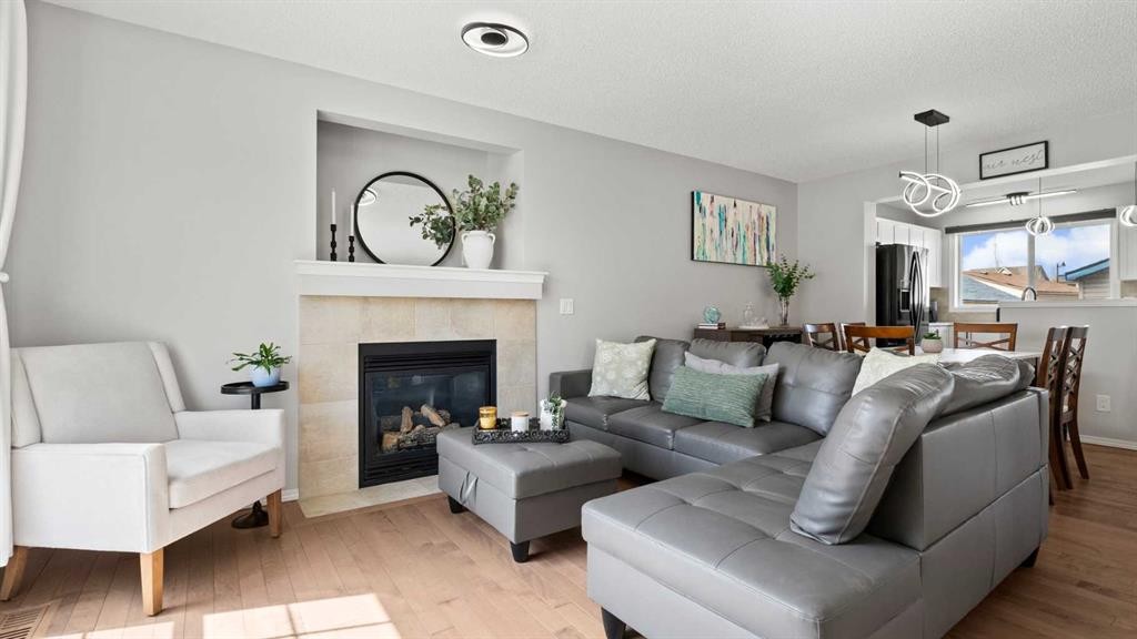 95 Elgin Meadows View Se, Calgary, AB - Indoor Photo Showing Living Room With Fireplace