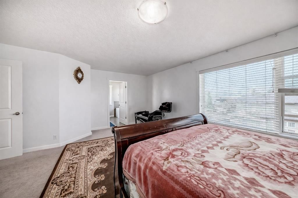 104 Panamount Terrace Nw, Calgary, AB - Indoor Photo Showing Bedroom
