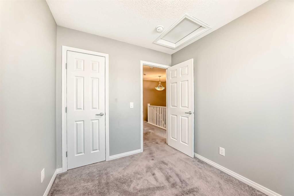 147 Windford Crescent Sw, Airdrie, AB - Indoor Photo Showing Other Room