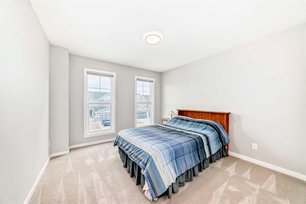 151 Sundown Way, Cochrane, AB - Indoor Photo Showing Bedroom