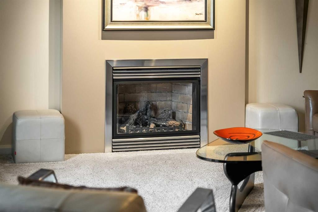 91 Sun Valley Drive Se, Calgary, AB - Indoor Photo Showing Living Room With Fireplace