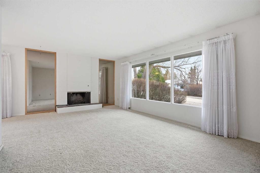 5220 Barron Drive Nw, Calgary, AB - Indoor Photo Showing Other Room With Fireplace