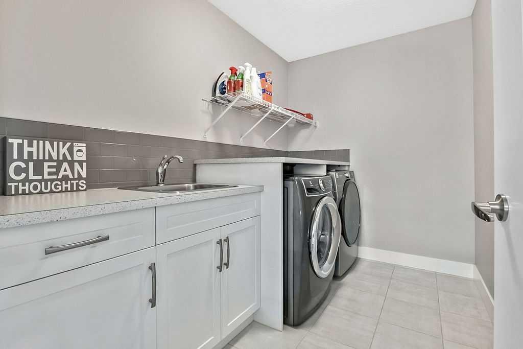 75 Sundown Way, Cochrane, AB - Indoor Photo Showing Laundry Room