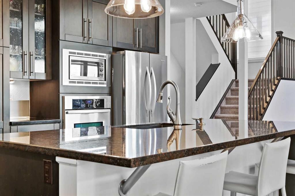 129 Springbluff Boulevard Sw, Calgary, AB - Indoor Photo Showing Kitchen With Upgraded Kitchen