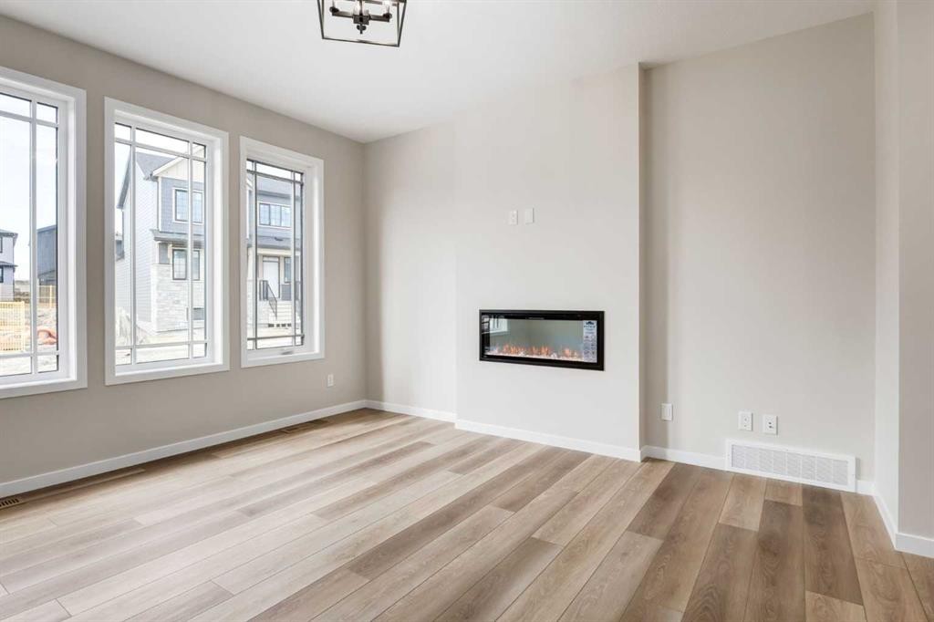 26 Alpine Gardens Sw, Calgary, AB - Indoor With Fireplace