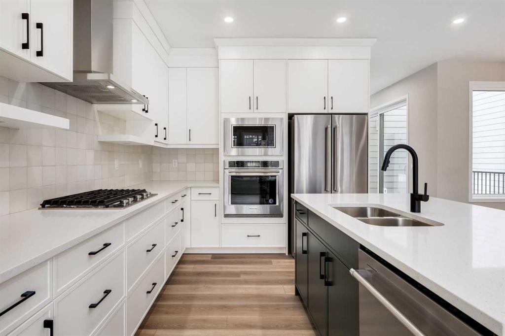 26 Alpine Gardens Sw, Calgary, AB - Indoor Photo Showing Kitchen With Double Sink With Upgraded Kitchen