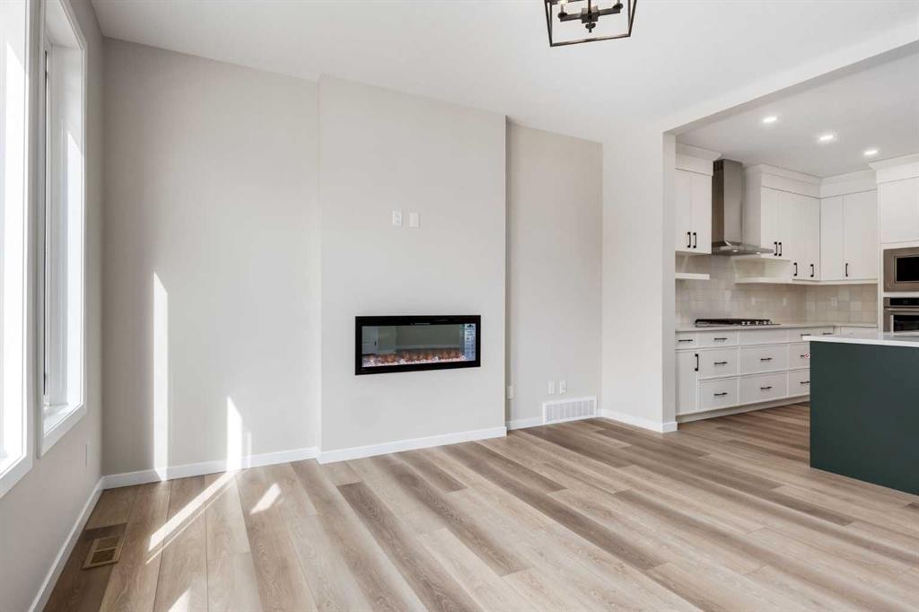 26 Alpine Gardens Sw, Calgary, AB - Indoor With Fireplace