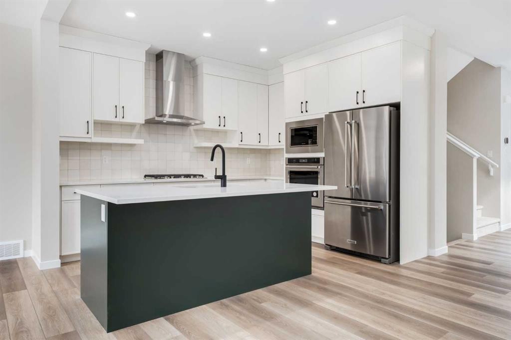26 Alpine Gardens Sw, Calgary, AB - Indoor Photo Showing Kitchen With Upgraded Kitchen