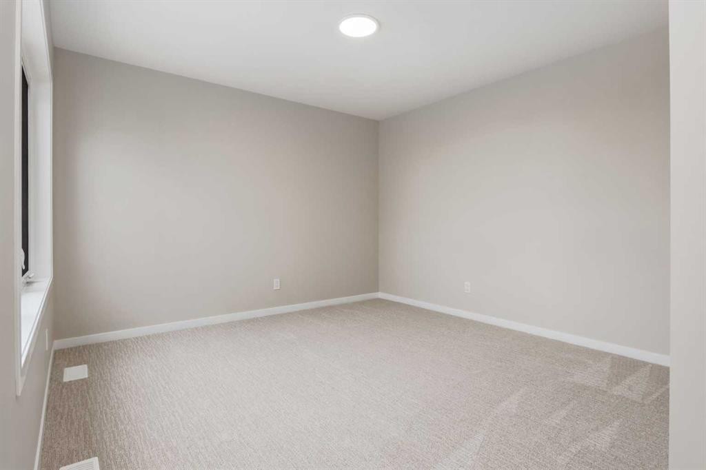 26 Alpine Gardens Sw, Calgary, AB - Indoor Photo Showing Other Room