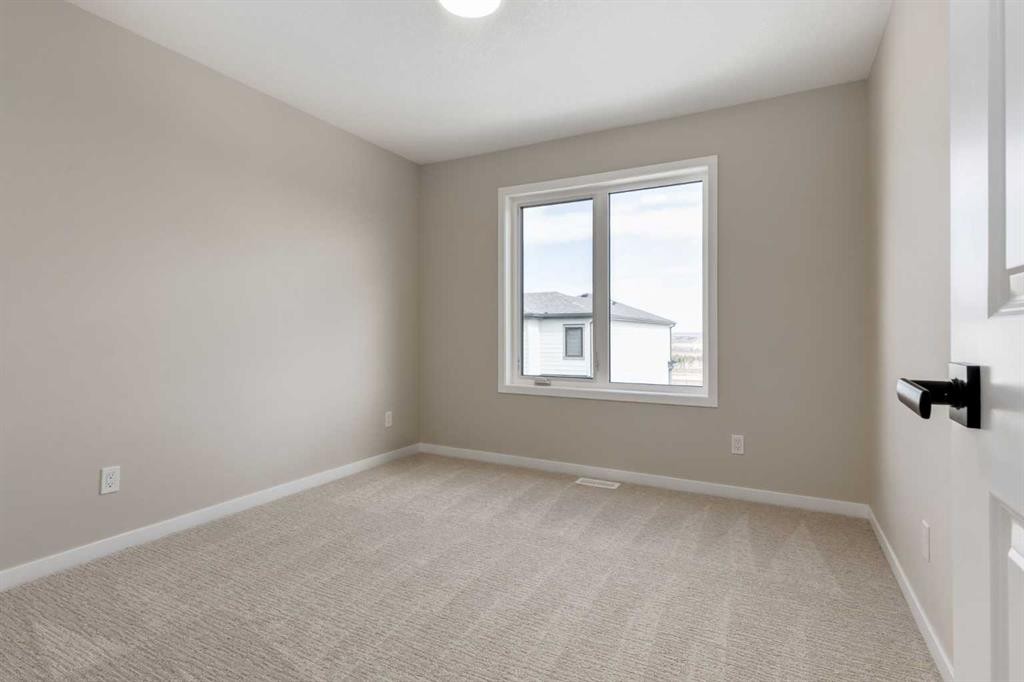 26 Alpine Gardens Sw, Calgary, AB - Indoor Photo Showing Other Room