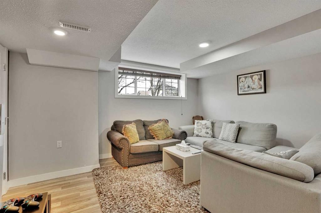 4 Martin Crossing Bay Ne, Calgary, AB - Indoor Photo Showing Living Room