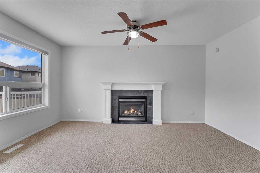 33 Saddlecrest Crescent Ne, Calgary, AB - Indoor Photo Showing Living Room With Fireplace
