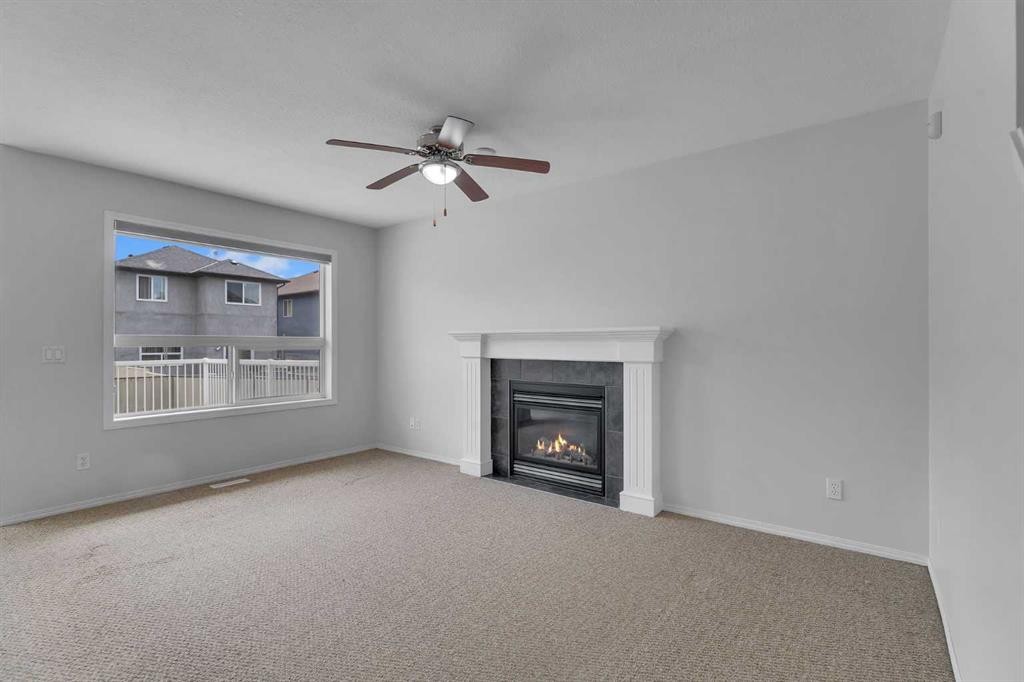 33 Saddlecrest Crescent Ne, Calgary, AB - Indoor Photo Showing Living Room With Fireplace