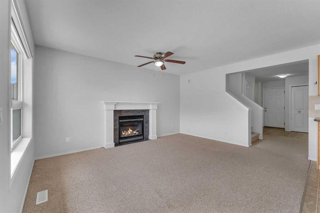 33 Saddlecrest Crescent Ne, Calgary, AB - Indoor Photo Showing Other Room With Fireplace