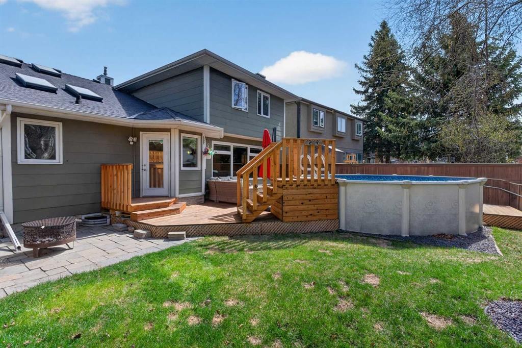 1486 Sunwood Road Se, Calgary, AB - Outdoor With Above Ground Pool