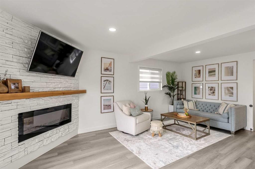 59 Rivercroft Close Se, Calgary, AB - Indoor Photo Showing Living Room With Fireplace