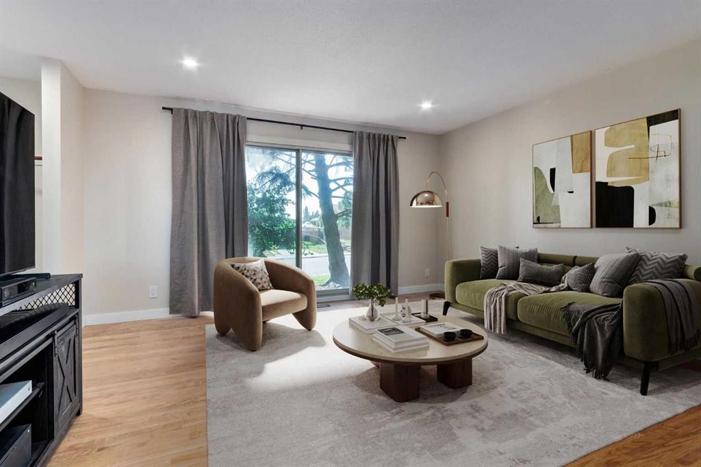 840 Raynard Crescent Se, Calgary, AB - Indoor Photo Showing Living Room With Fireplace