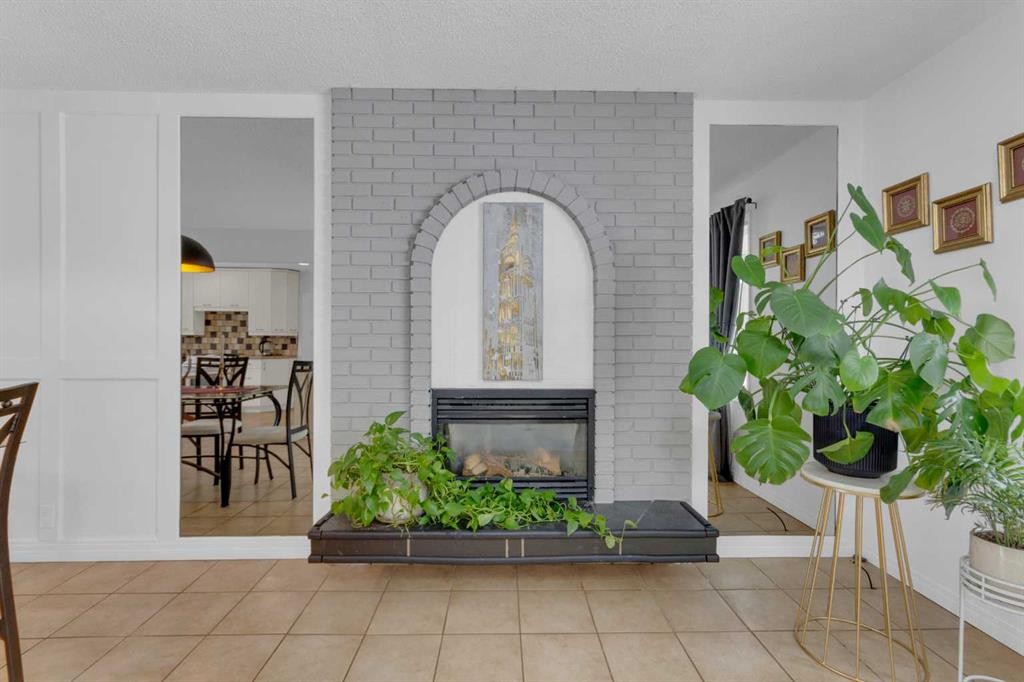 60 Dalhurst Way Nw, Calgary, AB - Indoor Photo Showing Other Room With Fireplace