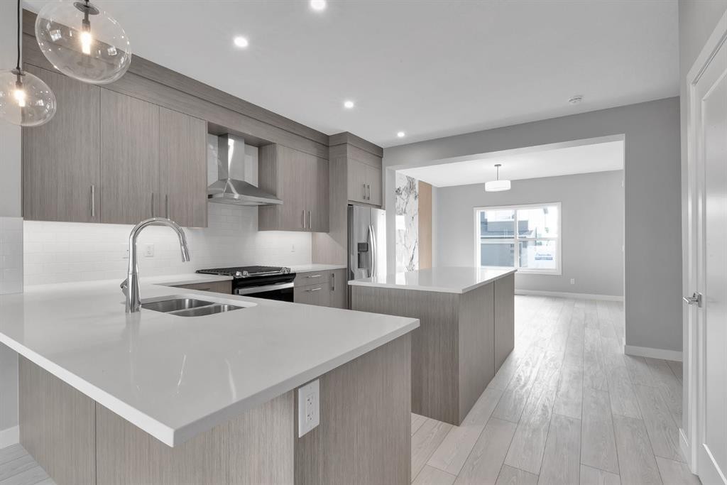 157 Dawson Wharf View, Chestermere, AB - Indoor Photo Showing Kitchen With Double Sink With Upgraded Kitchen