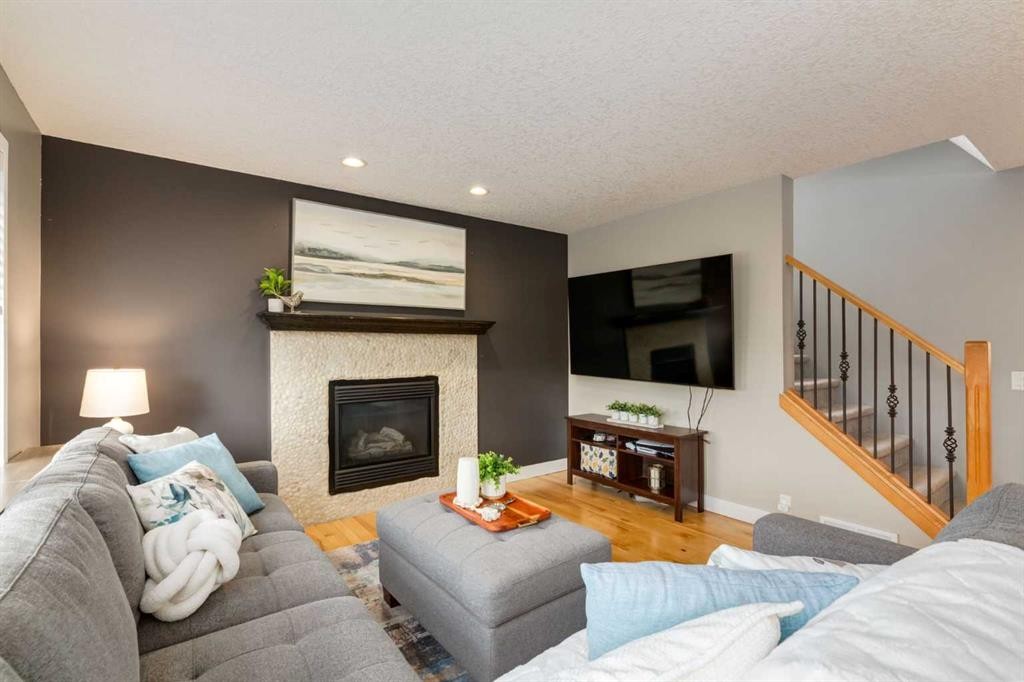 16 Prestwick Road Se, Calgary, AB - Indoor Photo Showing Living Room With Fireplace