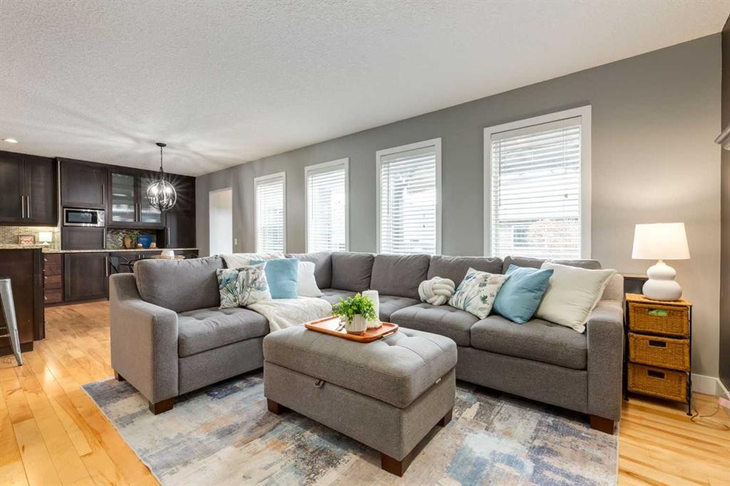 16 Prestwick Road Se, Calgary, AB - Indoor Photo Showing Living Room
