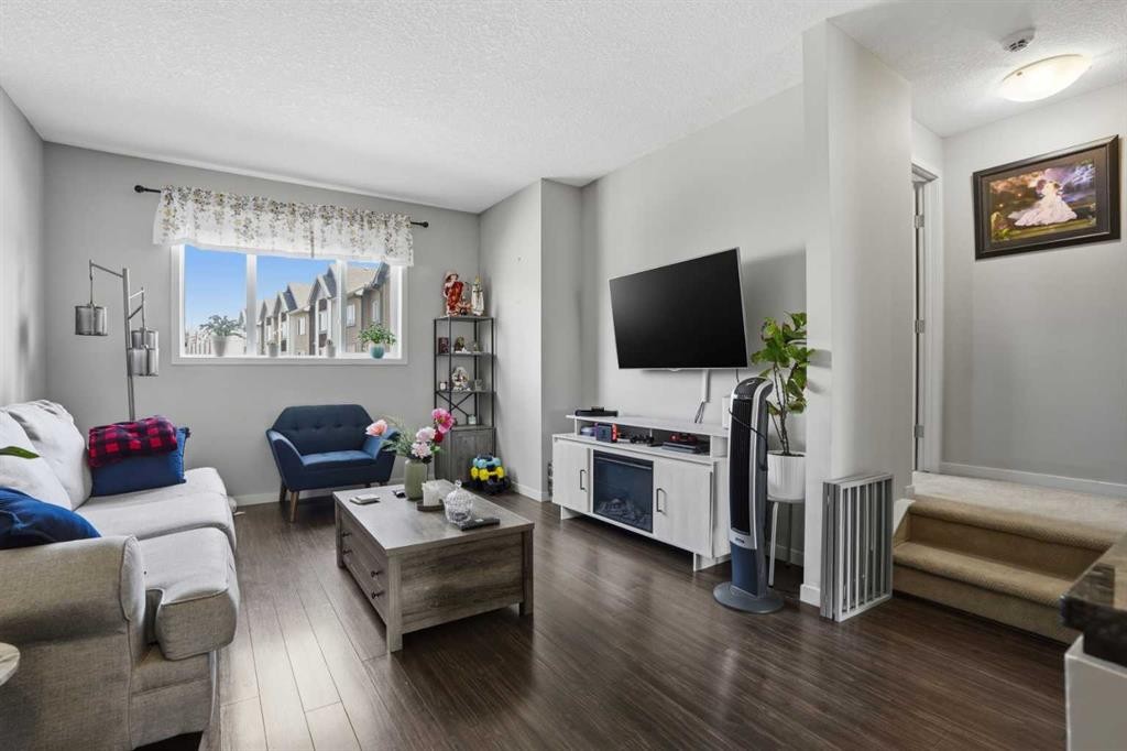 227 Copperpond Row Se, Calgary, AB - Indoor Photo Showing Living Room