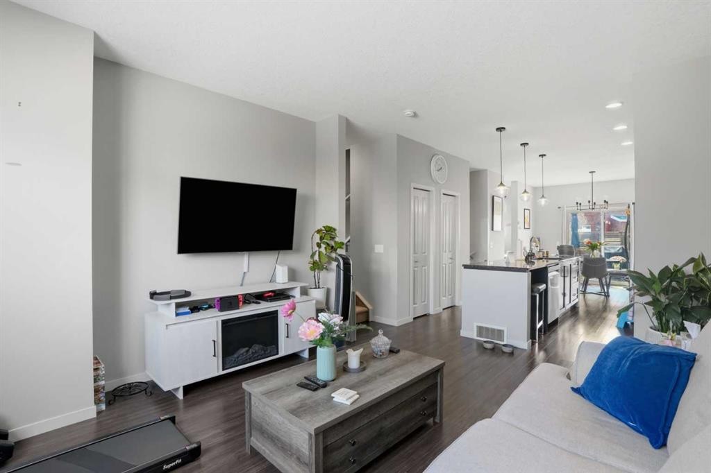 227 Copperpond Row Se, Calgary, AB - Indoor Photo Showing Living Room