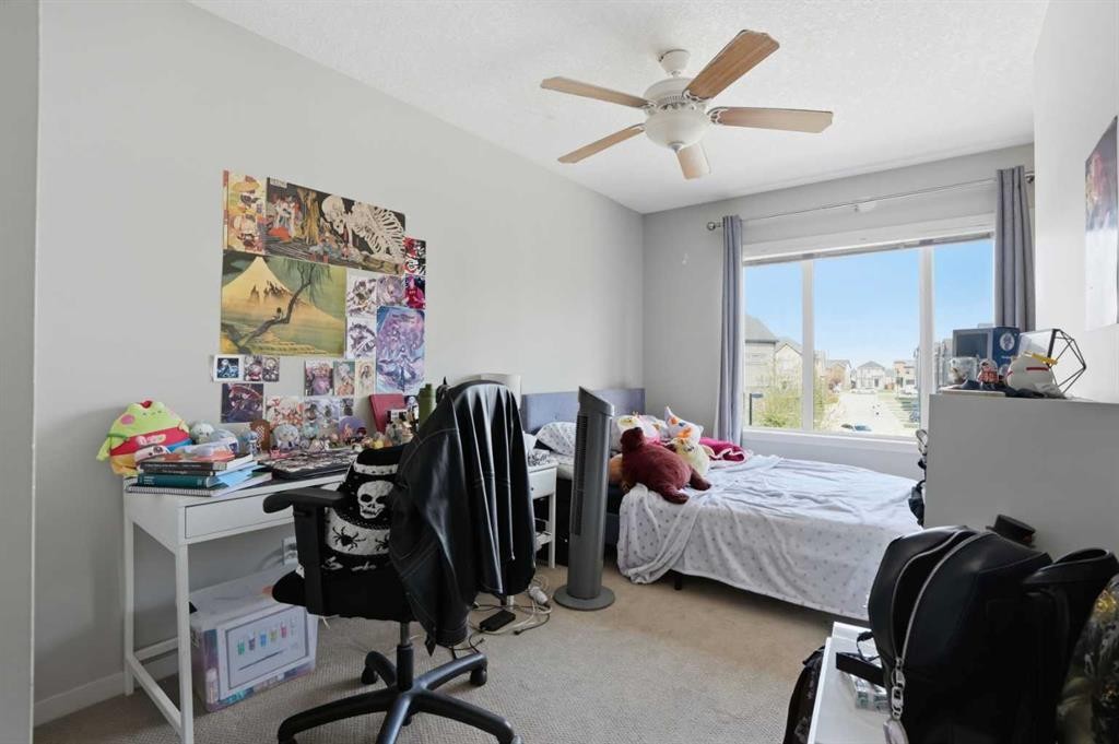 227 Copperpond Row Se, Calgary, AB - Indoor Photo Showing Bedroom