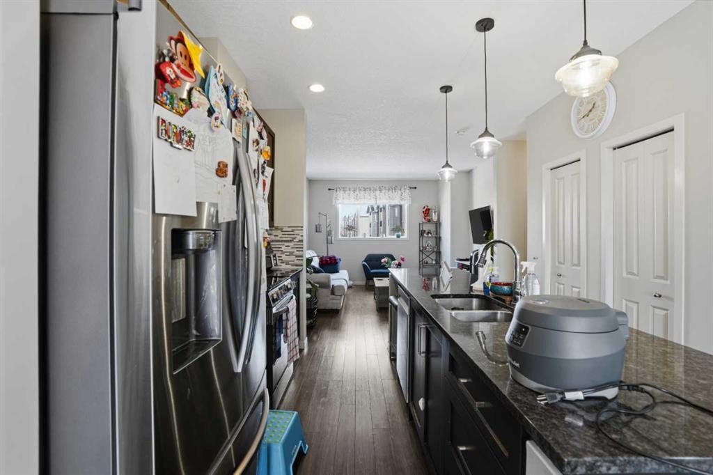 227 Copperpond Row Se, Calgary, AB - Indoor Photo Showing Kitchen With Double Sink With Upgraded Kitchen